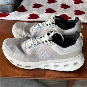 On Running Beige and White Athletic Shoes